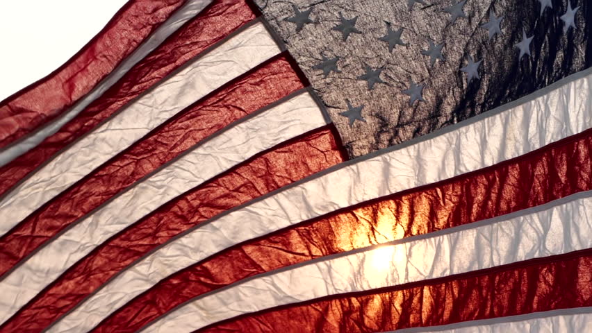 Fourth of July Independence Day, American USA flag waving in the wind against sun flare overlay nature outdoor background, Slow Motion. Concept of 4th of July, Memorial Day, Veterans Day, Labor Day Royalty-Free Stock Footage #1103489657