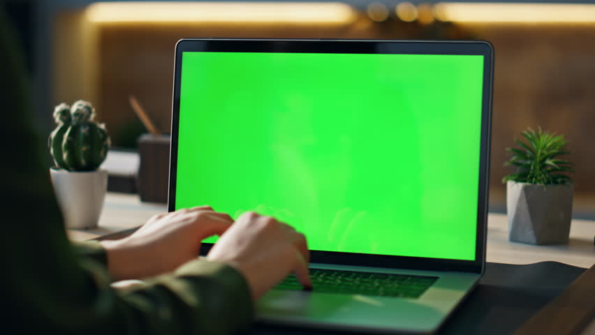 Woman hands typing at mockup laptop working remotely in modern workplace close up. Unknown girl manager writing on keyboard chroma key computer indoors. Businesswoman using green screen notebook. Royalty-Free Stock Footage #1103495151