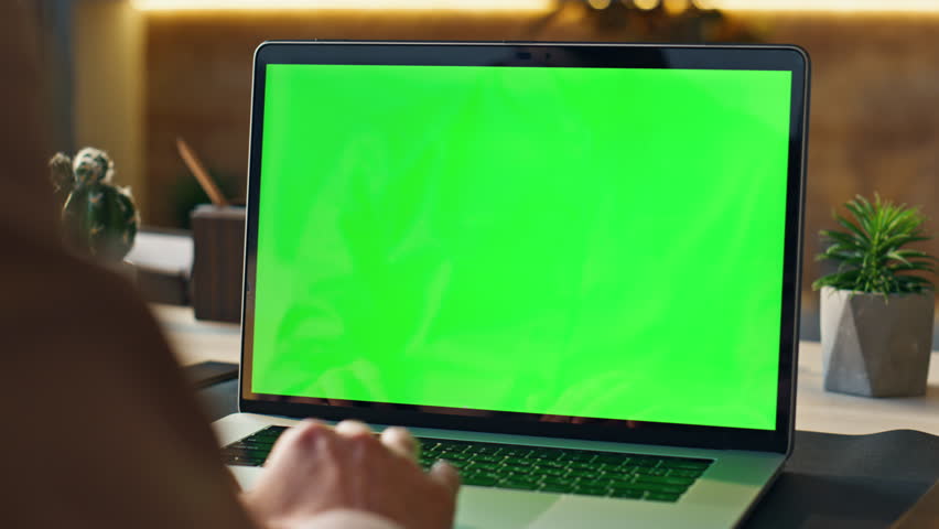 Unknown worker scrolling touchpad green screen laptop at modern workplace close up. Manager hand using computer keyboard searching data in internet indoors. Businessman working at mockup notebook. Royalty-Free Stock Footage #1103495159