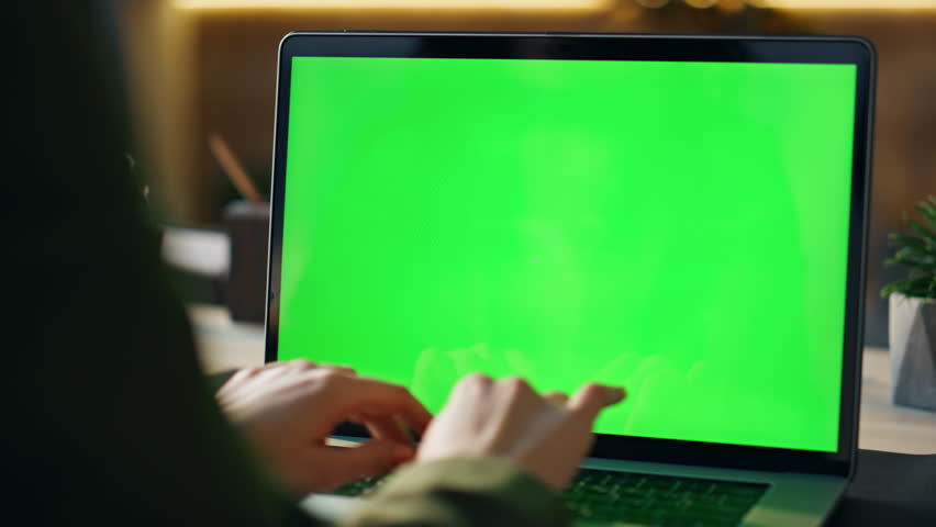 Manager hands typing on greenscreen laptop at office desk close up. Unknown business person working at chroma key computer on remote job indoors. Freelancer writing on notebook with green screen. Royalty-Free Stock Footage #1103495171