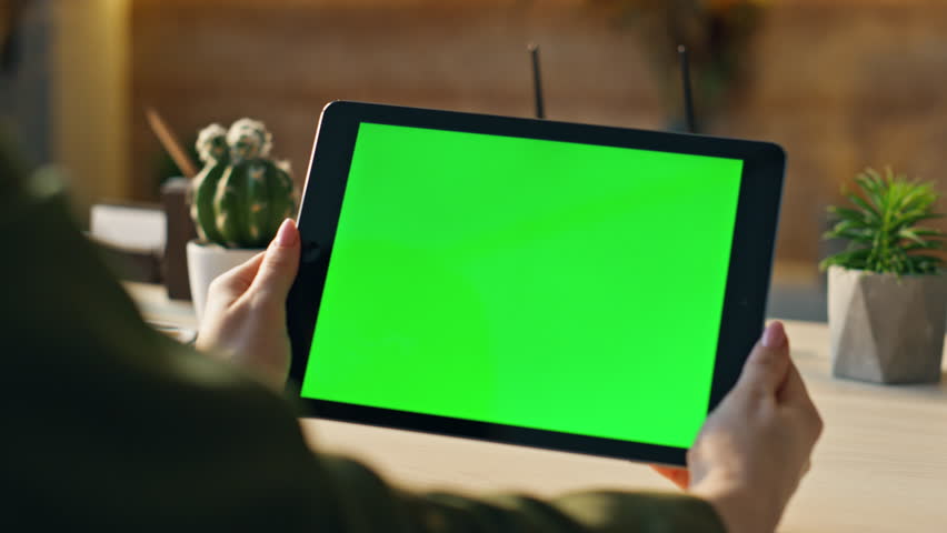 Closeup green screen tablet in businesswoman hands. Unknown woman manager holding mockup device watching business data. Unrecognizable worker looking online business webinar sitting in modern office. Royalty-Free Stock Footage #1103495195