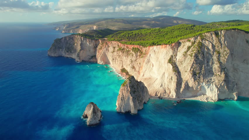 Keri cliffs on Zakynthos island, Ionian sea, Greece. Beautiful Akra Keri rock in the sea in Zante. Aerial drone footage of sea coast with turquoise sea water on Zante Greek island. 