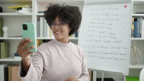 Young african american woman teacher teaching online maths lesson at university classroom