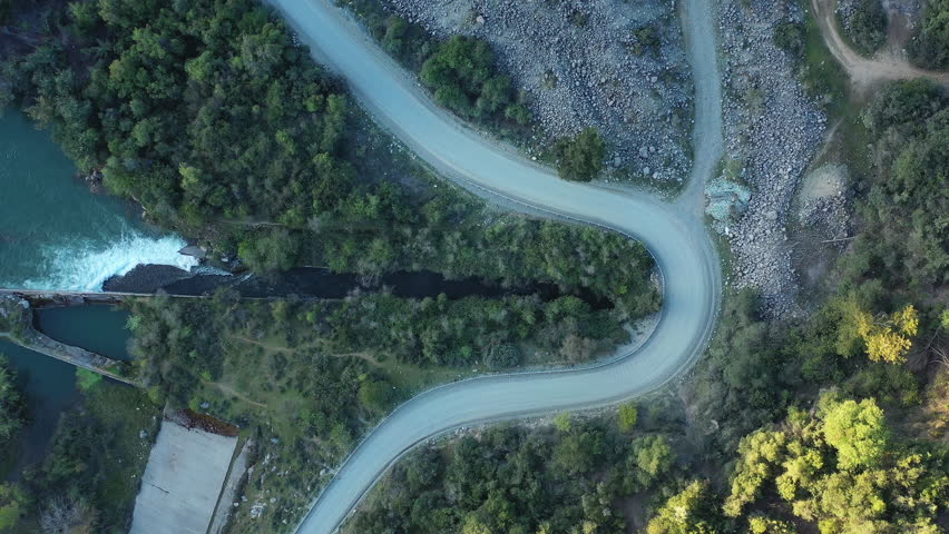 Streams of water between mountain stones, Maule river, Chile