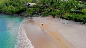 Saint Lucia or St Lucia tropical Island with the blue turqouse colored ocean at sunset. A couple of men and women walking on the beach - Powered by Shutterstock - Get 15% off with code: PIKWIZARD15