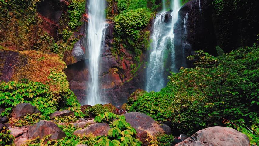 Waterfall in tropical rainforest jungle on nature background 4K