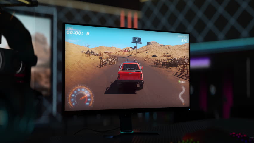 Playing the newest digital racing simulator computer video game. Enjoying the gaming hobby in the digital racing simulator. Completing the desert drifting level in the modern digital racing simulator. | Shutterstock HD Video #1103529075