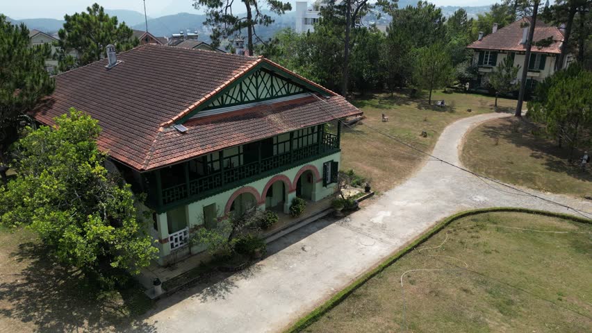 Drone footage along old french colonial houses in the old quarter of Dalat city, south Vietnam