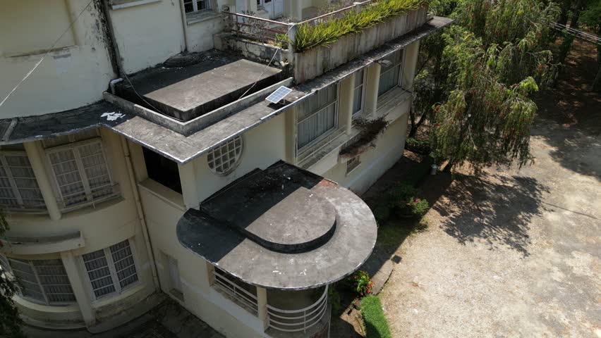 Drone footage along a beautiful old building transformed now in hotel on a hill in Dalat city , south Vietnam 2-2