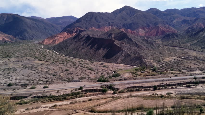 Distant View of a Road in the "Quebrada de Humahuaca", a Narrow Mountain Valley located in the province of Jujuy in northwest Argentina.  