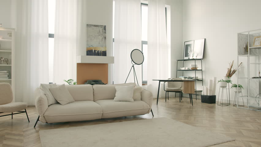 Dolly shot home interior design. Modern clean living room with soft and cozy sofa with pillows. Home sweet home background. Cinematic view stylish urban loft apartment with large windows, high ceiling | Shutterstock HD Video #1103531961