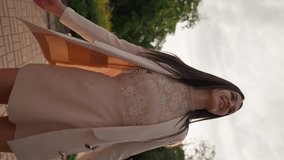 Vertical Video, Young Beautiful Brunette Woman in Casual Clothes Spinning with Happiness and Joy in Center City Outdoors in Sunlight. Happy Girl Slim Figure Having Fun Sunny Day. Freedom and Wellbeing - Powered by Shutterstock - Get 15% off with code: PIKWIZARD15