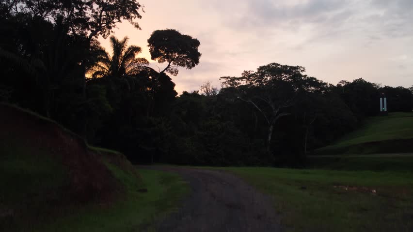 Splendid sunset in the Gamboa region of Panama. Drone flyover in forest near river