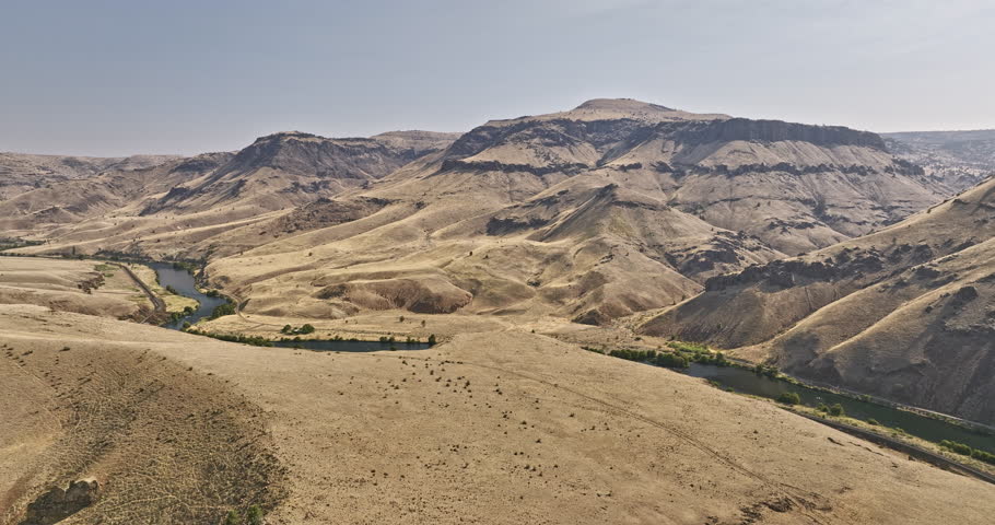 Deschutes River Oregon Aerial v81 cinematic drone flyover the region capturing barren canyon landscape of Deschutes river Antoken creek with railroad bridge - Shot with Mavic 3 Cine - August 2022