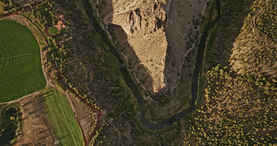 Terrebonne Oregon Aerial v54 vertical top down view, flyover Smith Rock State Park capturing winding crooked river and unique canyon rock formation from above - Shot with Mavic 3 Cine - August 2022