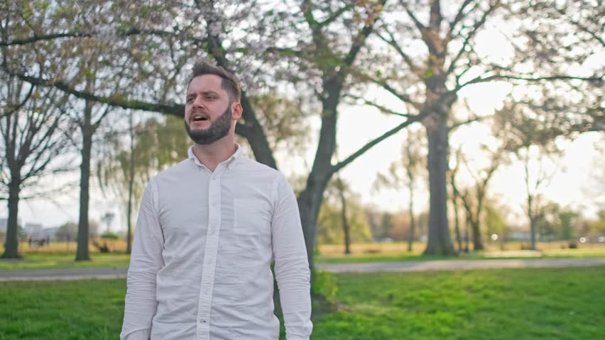 Musician singing in the park during a sunset