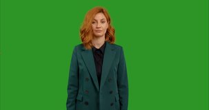 Skeptic woman in showing no crossed hands X Sign on green screen background. Female protests expressing refusal and dissaproval. Sign language content.