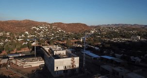 4K aerial Windhoek capital residential central district bright sunset drone video, upmarket houses, new embassy construction, Namibia