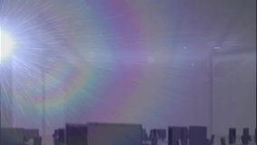 Animation of interface with data processing and rainbow lens flare against aerial view of cityscape. Computer interface and business technology concept - Powered by Shutterstock - Get 15% off with code: PIKWIZARD15