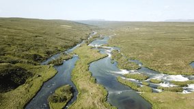 Video drone aerial shot of a flowing river in Iceland