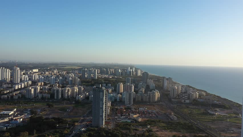 Aerial view of the city of Netanya and its coastline - part of the Israeli coastal plain, at sunset