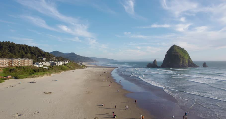Haystack Rock on Oregon's Cannon Beach, Tourist Travel Destination - Aerial Royalty-Free Stock Footage #1103566775