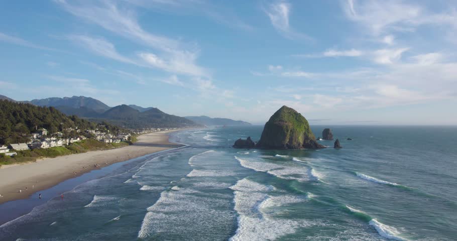 Breathtaking Aerial of Haystack Rock on Cannon Beach, Oregon in Summer Royalty-Free Stock Footage #1103567213