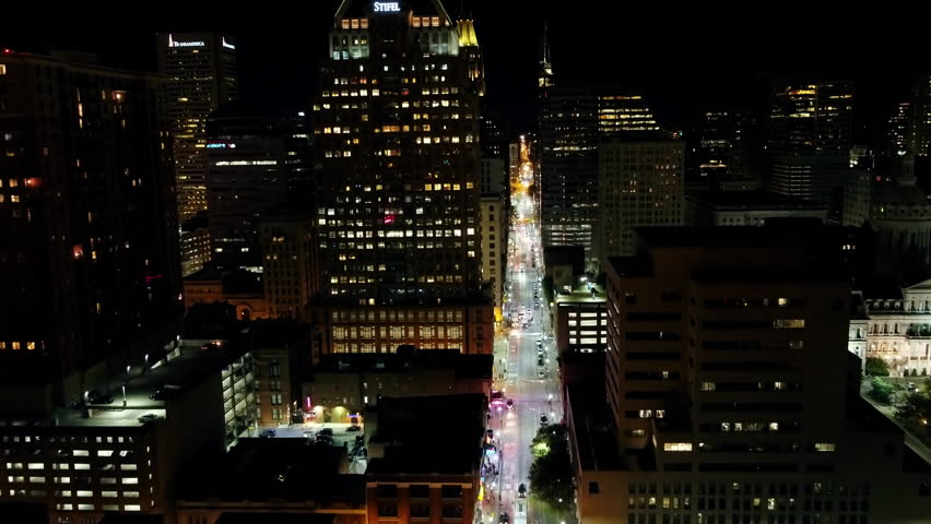 Aerial Backward Shot Of Vehicles On Illuminated City Roads At Night - Baltimore, Maryland