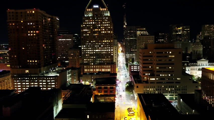 Aerial Panning Shot Of Illuminated Buildings And Streets In City At Night - Baltimore, Maryland