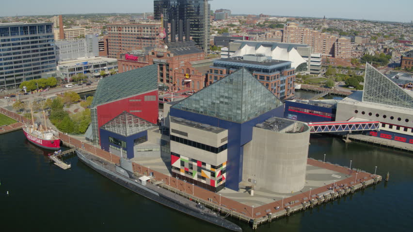 Aerial Shot Of Buildings By A River In City On Sunny Day - Baltimore, Maryland