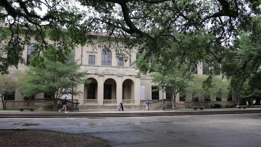 Hill Memorial Library with students walking in the distance on the campus of Louisiana State University in Baton Rouge, Louisiana with stable establishing shot.