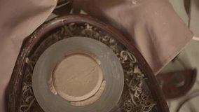 a woman works on a potter's wheel. view from above. closeup.slow motion video. High quality Full HD video recording