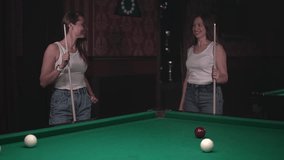 Russian billiards. two women play billiards. slow motion video. High quality Full HD video recording