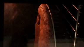 Baking cake in heart shape. Vertical video. Woman hands taking from oven baked chocolate cake. Pie baked in oven. Process of cooking sweet pastry at home - Powered by Shutterstock - Get 15% off with code: PIKWIZARD15