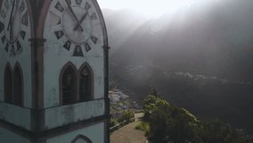 Drone shot of church clocktower of Fatima chapel on hill in Sao Vicente town, Madeira, Portugal