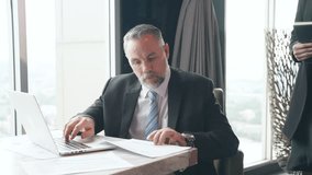 Asian woman secretary working on digital tablet and discussion business project with senior executive CEO at modern office room. Corporate business people partnership and teamwork meeting concept. - Powered by Shutterstock - Get 15% off with code: PIKWIZARD15