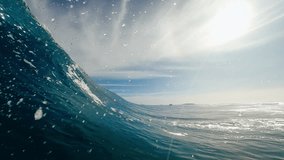 POV view from inside the tube of surfer riding perfect blue ocean wave getting barreled in the South Pacific - Powered by Shutterstock - Get 15% off with code: PIKWIZARD15