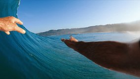 POV of Surfer in the Barrel, View from inside the tube of surfer riding perfect blue ocean wave - Powered by Shutterstock - Get 15% off with code: PIKWIZARD15
