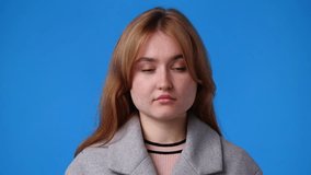 4k video of cute girl over blue background.