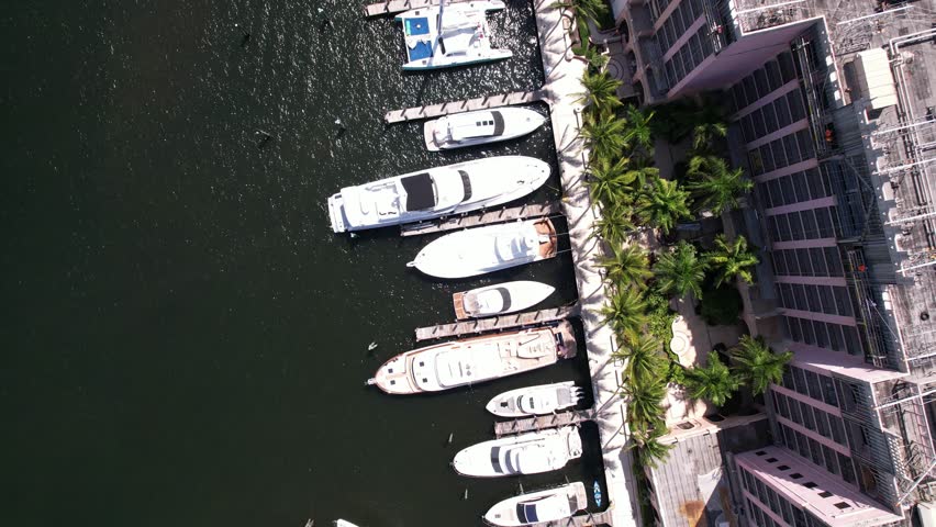 An aerial footage of boats moored up in the harbor on Lake Boca Raton, Florida