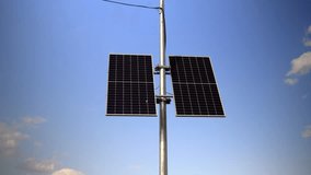 This video shows solar panels installed on a pole in the city to power the surveillance cameras used for speed control