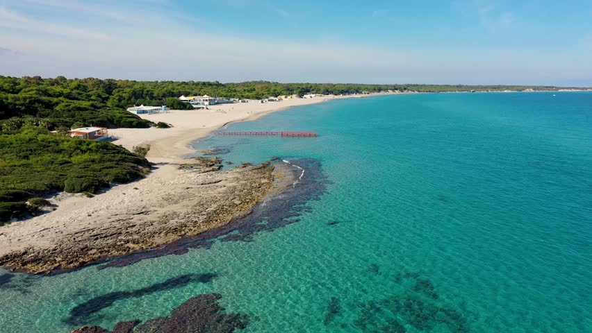 Aerial view of Baia dei Turchi, Puglia region, Italy. Turkish Bay (or Baia dei Turchi), this coast of Apulia is one of the most important ecosystems in Salento, Italy. Seacoast of Baia dei Turchi. Royalty-Free Stock Footage #1103612657