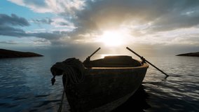 A close-up view of an old rowing boat loosely tied with a rope at the waters edge, its oars submerged in the water. - Powered by Shutterstock - Get 15% off with code: PIKWIZARD15