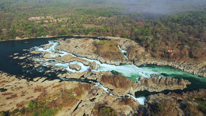 The Khone Falls of the Mekong and its arid vegetation in Asia, Laos, Champassak, the 4000 islands, Don Det, on a sunny day.
