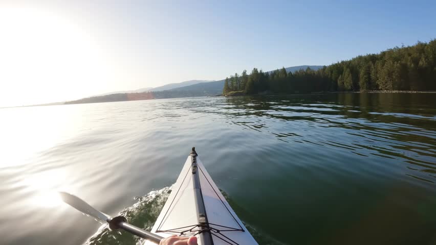 Kayaking in Indian Arm near Belcarra, Vancouver, BC, Canada. Sunny Sunset. Adventure Travel Concept Royalty-Free Stock Footage #1103628653