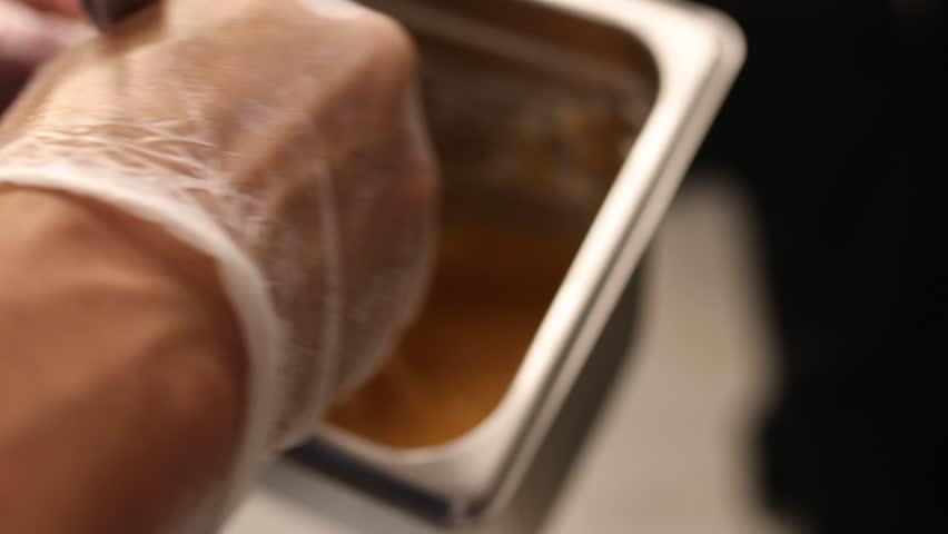 Chef Mixing Sauce In The Kitchen.