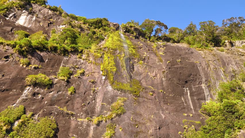 Milford Sound waterfall, New Zealand’s South Island, Fiordland National Park