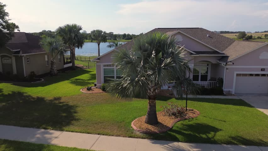Flyover of a house going out to a lake