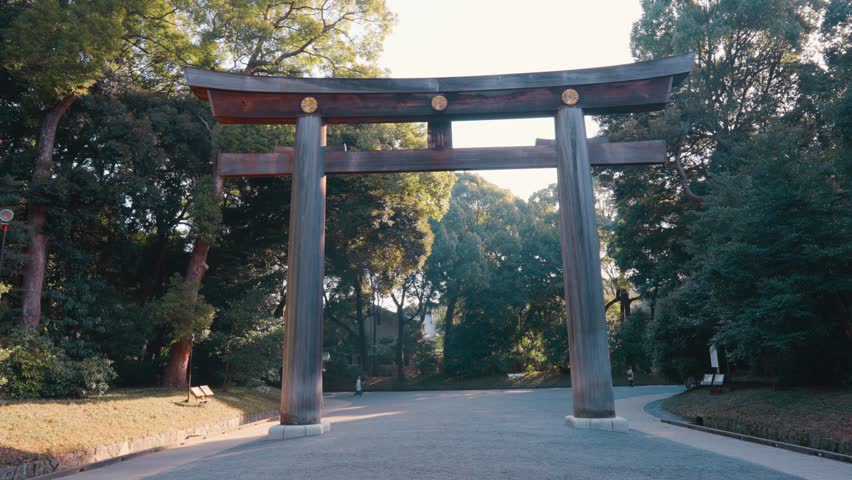 Torii gate at the Meiji Jingu Shrine in Shibuya, Tokyo, Japan on sunny day