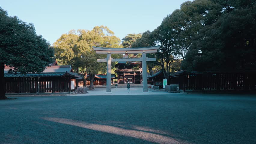 Torii gate at the Meiji Jingu Shrine in Shibuya, Tokyo, Japan on sunny day Royalty-Free Stock Footage #1103645845